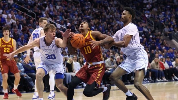 Jan 16, 2024; Provo, Utah, USA; Iowa State Cyclones guard Keshon Gilbert (10) goes to the basket between Brigham Young Cougars guard Dallin Hall (30) and guard Jaxson Robinson (2) during the second half at Marriott Center. Mandatory Credit: Rob Gray-USA TODAY Sports